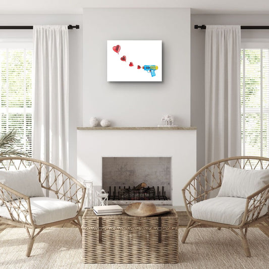 Living room with wicker chairs, a coffee table, and a fireplace with a heart-themed painting above.